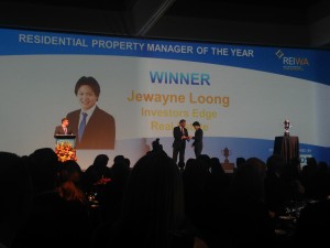 Justine Valender accepting 2013 REIWA Acheivement Award